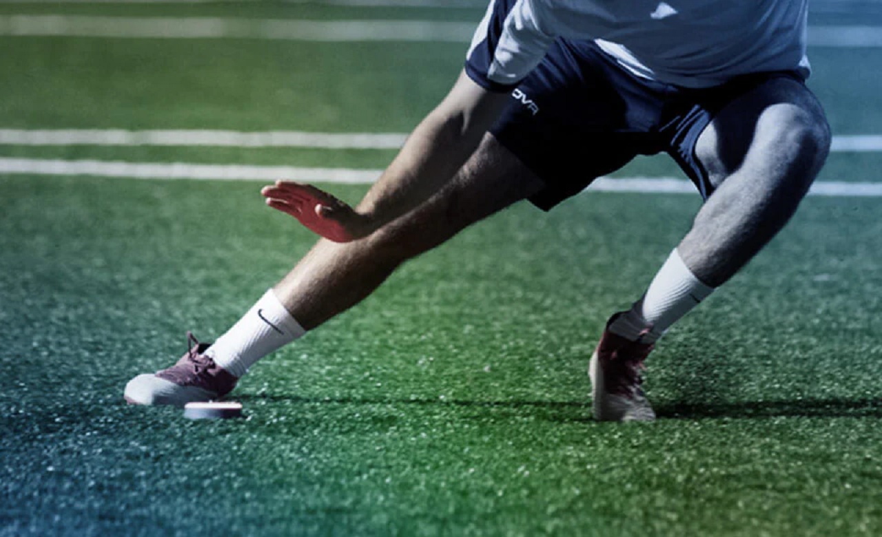 Soccer player engaging in agility drills to prevent soccer injuries and enhance on-field performance.